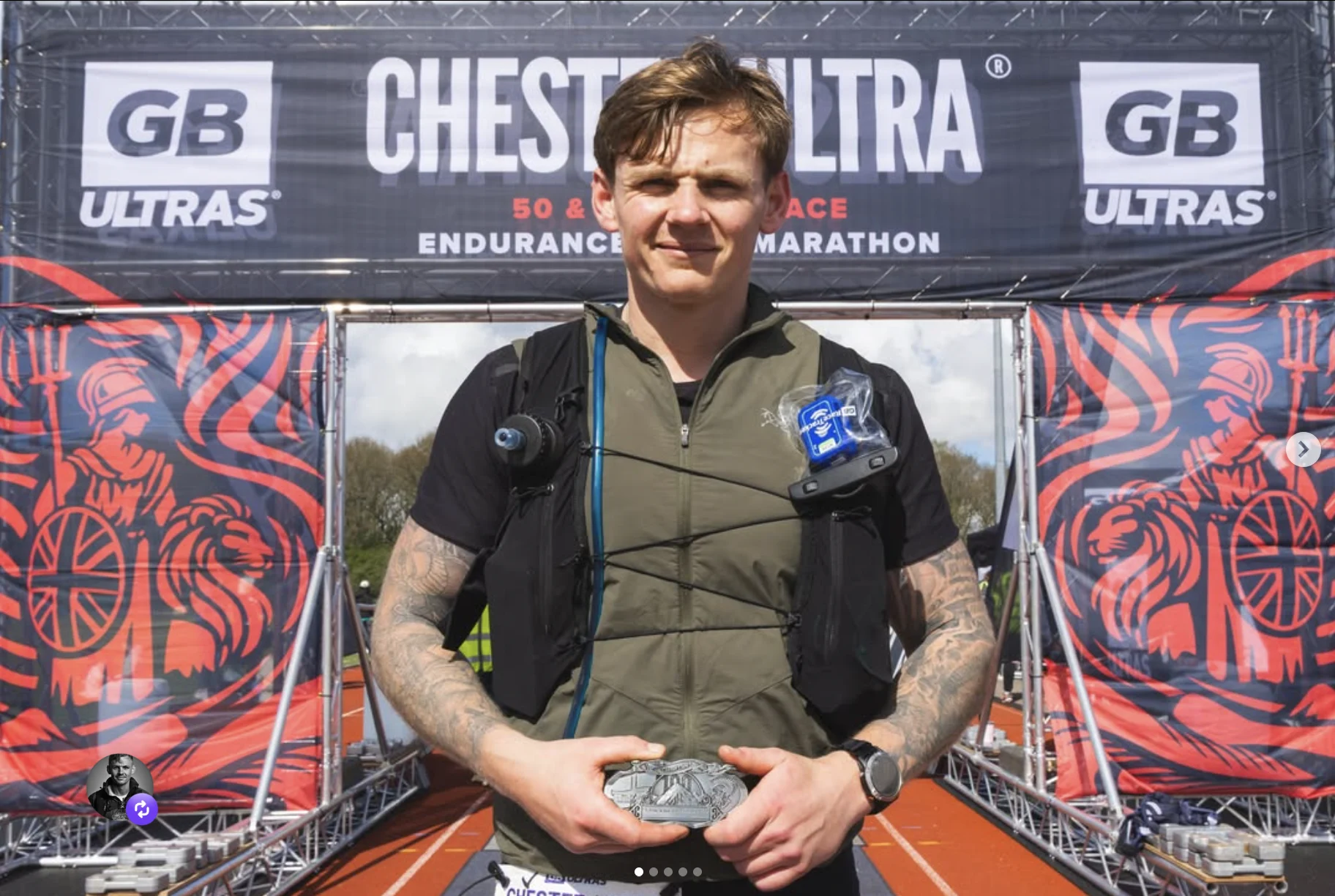Jimmy holding a medal at the Chester Ultra finish